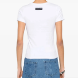 White t-shirt worn by a person, showing the t-shirt's fit