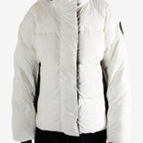 White coat worn by a person, showing the coat's fit