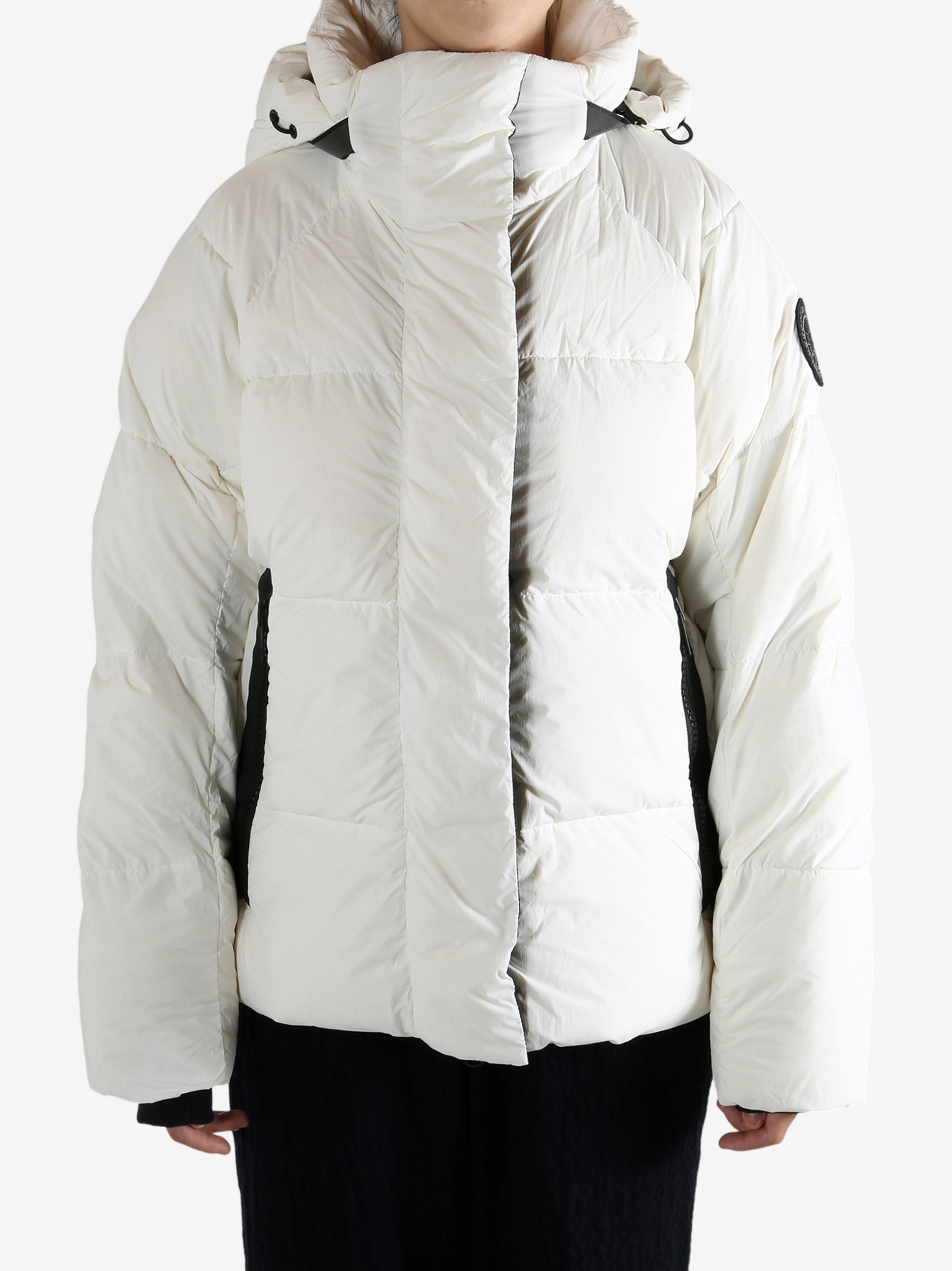 White coat worn by a person, showing the coat's fit