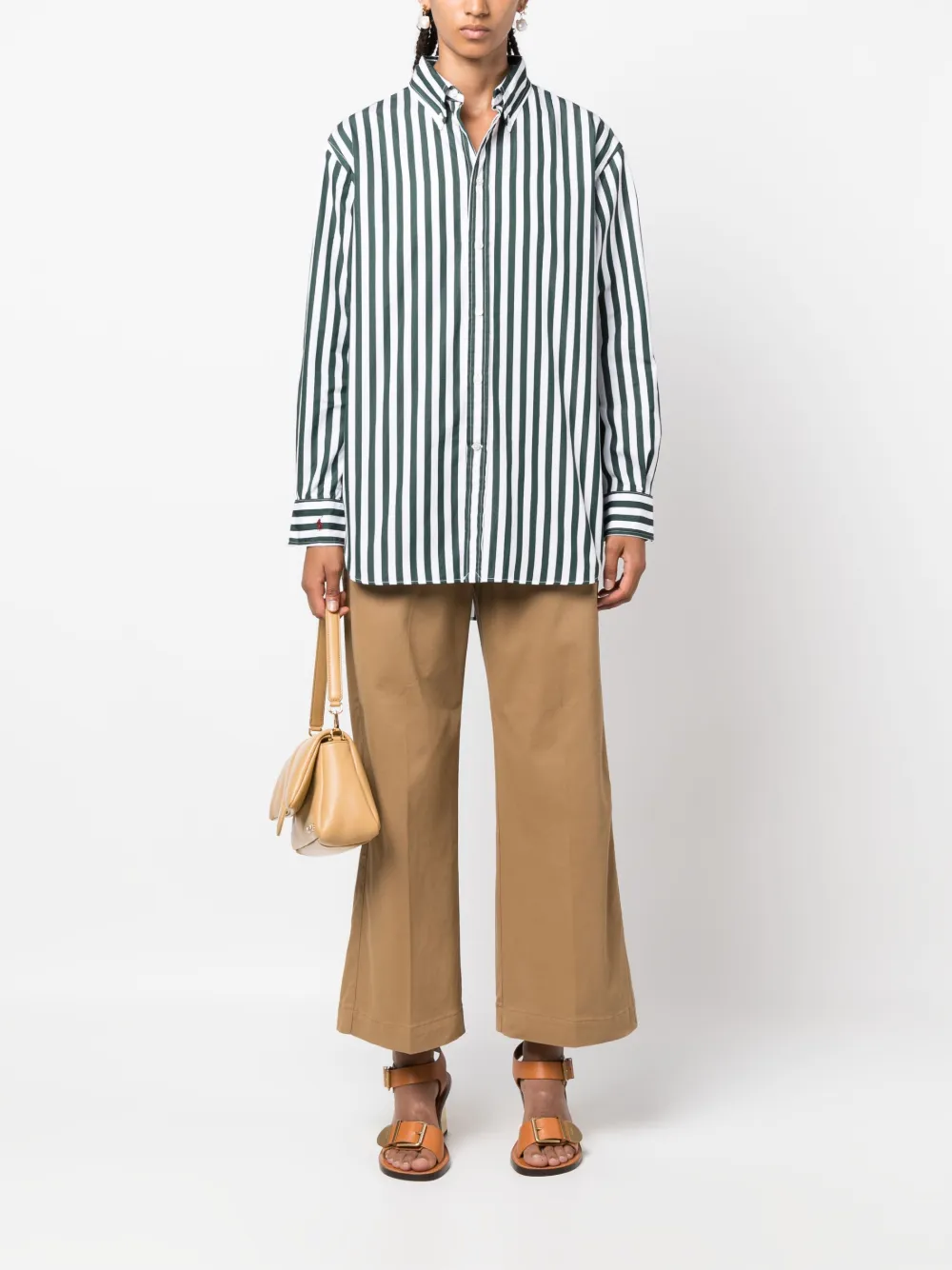 Brown pant worn by a person, showing the pant's fit