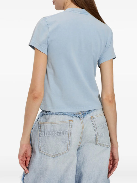 Blue top worn by a person, showing the top fit