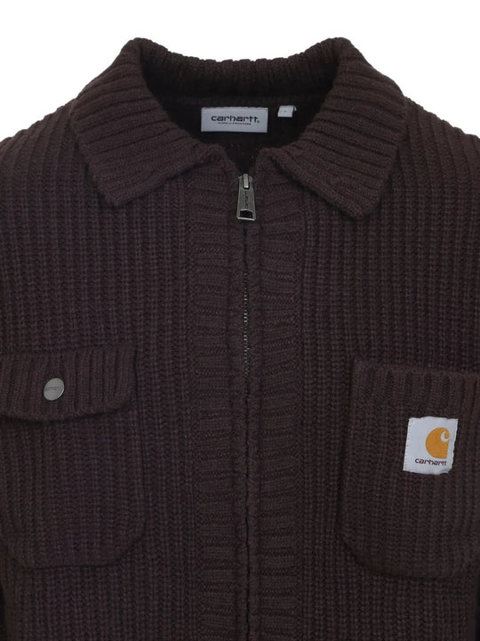Close up of brown jackets, showing texture of the acrylic and wool and nylon fabric