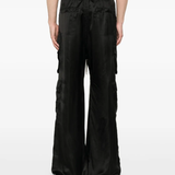 Black pants worn by a person, showing the pants fit