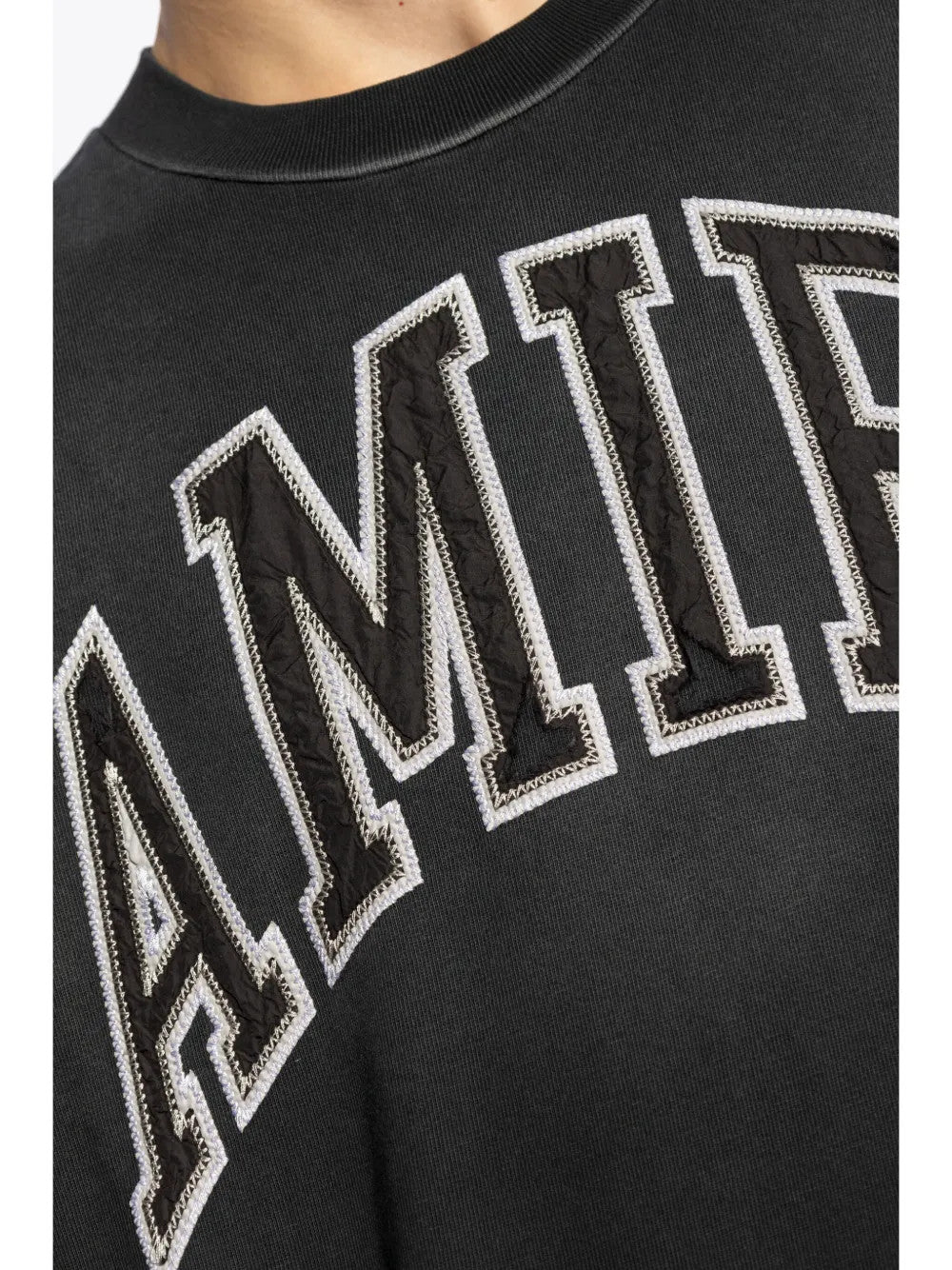 Close up of Black t-shirt, showing texture of the 100% cotton fabric