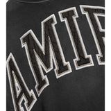 Close up of Black t-shirt, showing texture of the 100% cotton fabric