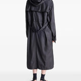 Black coat worn by a person, showing the coat's fit