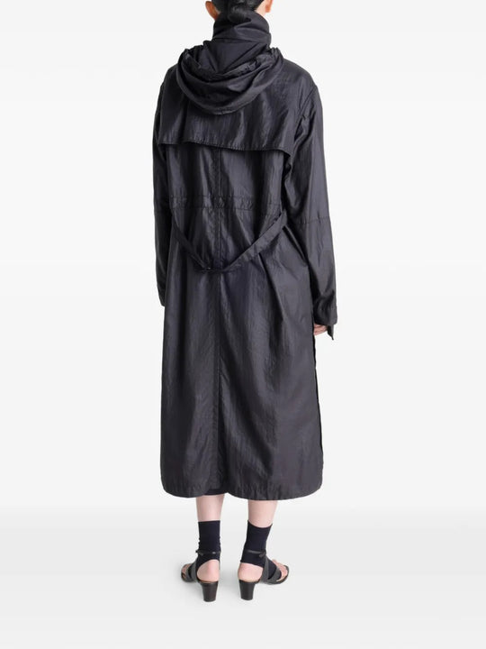 Black coat worn by a person, showing the coat's fit