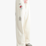 White pants worn by a person, showing the pants fit