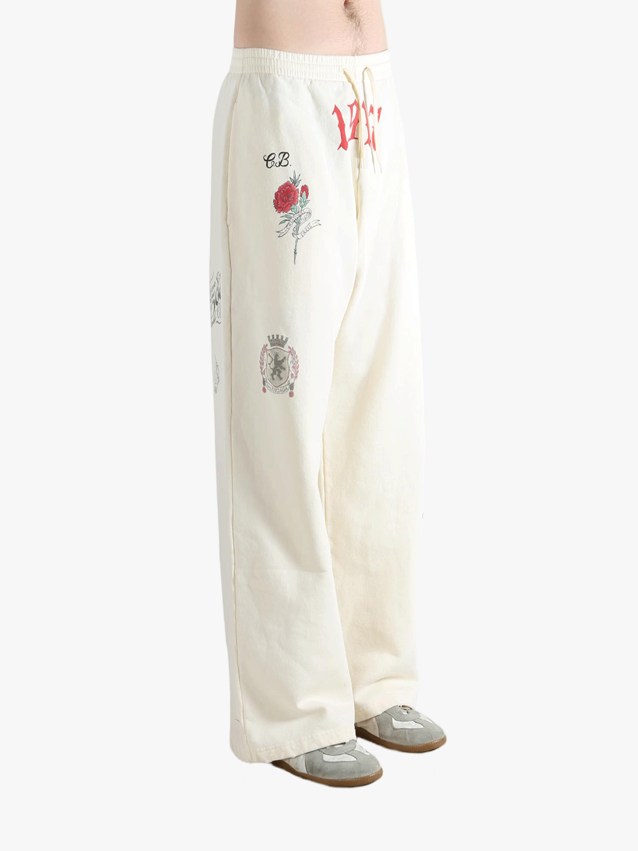 White pants worn by a person, showing the pants fit