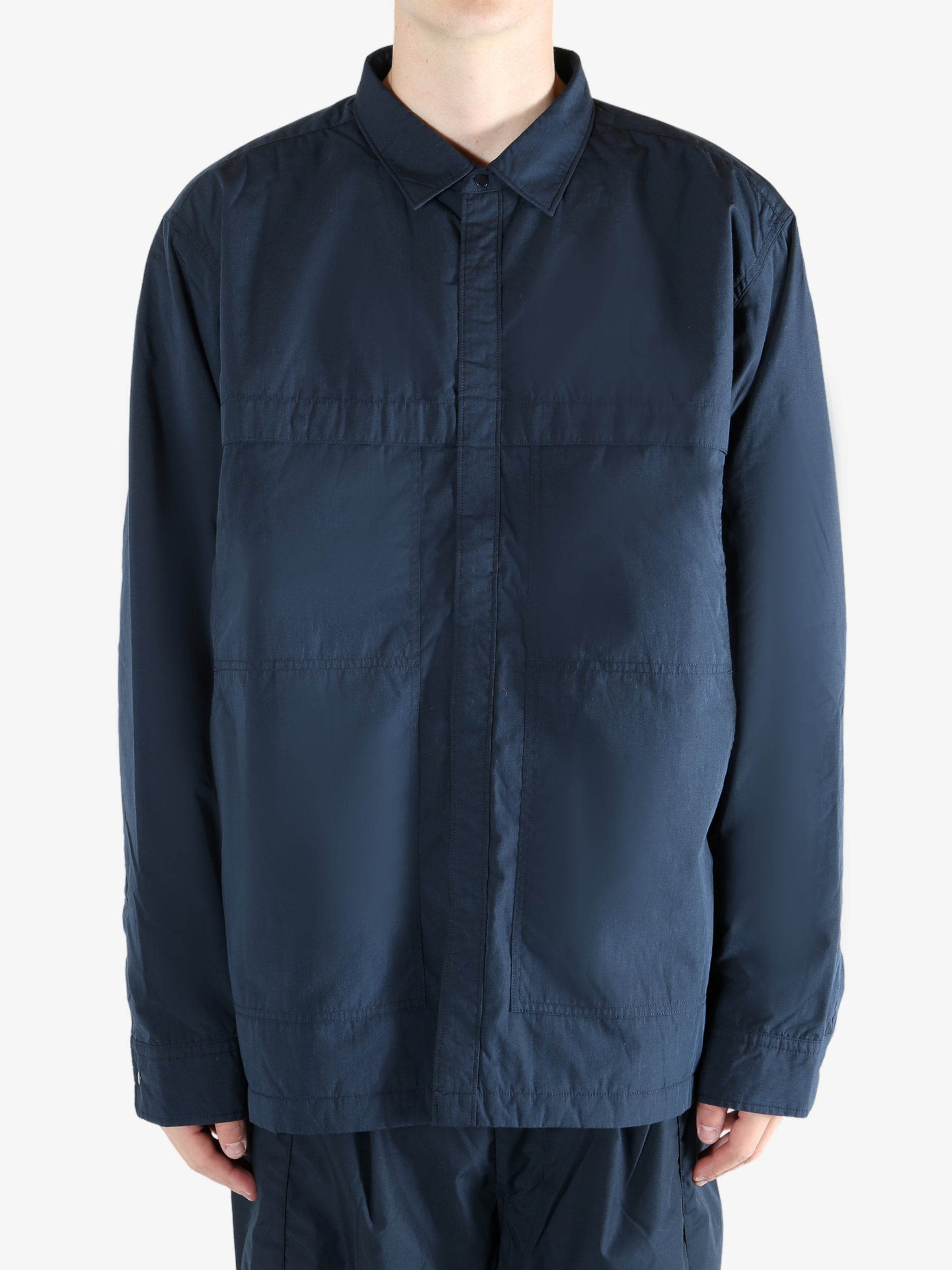 Navy jacket worn by a person, showing the jacket's fit