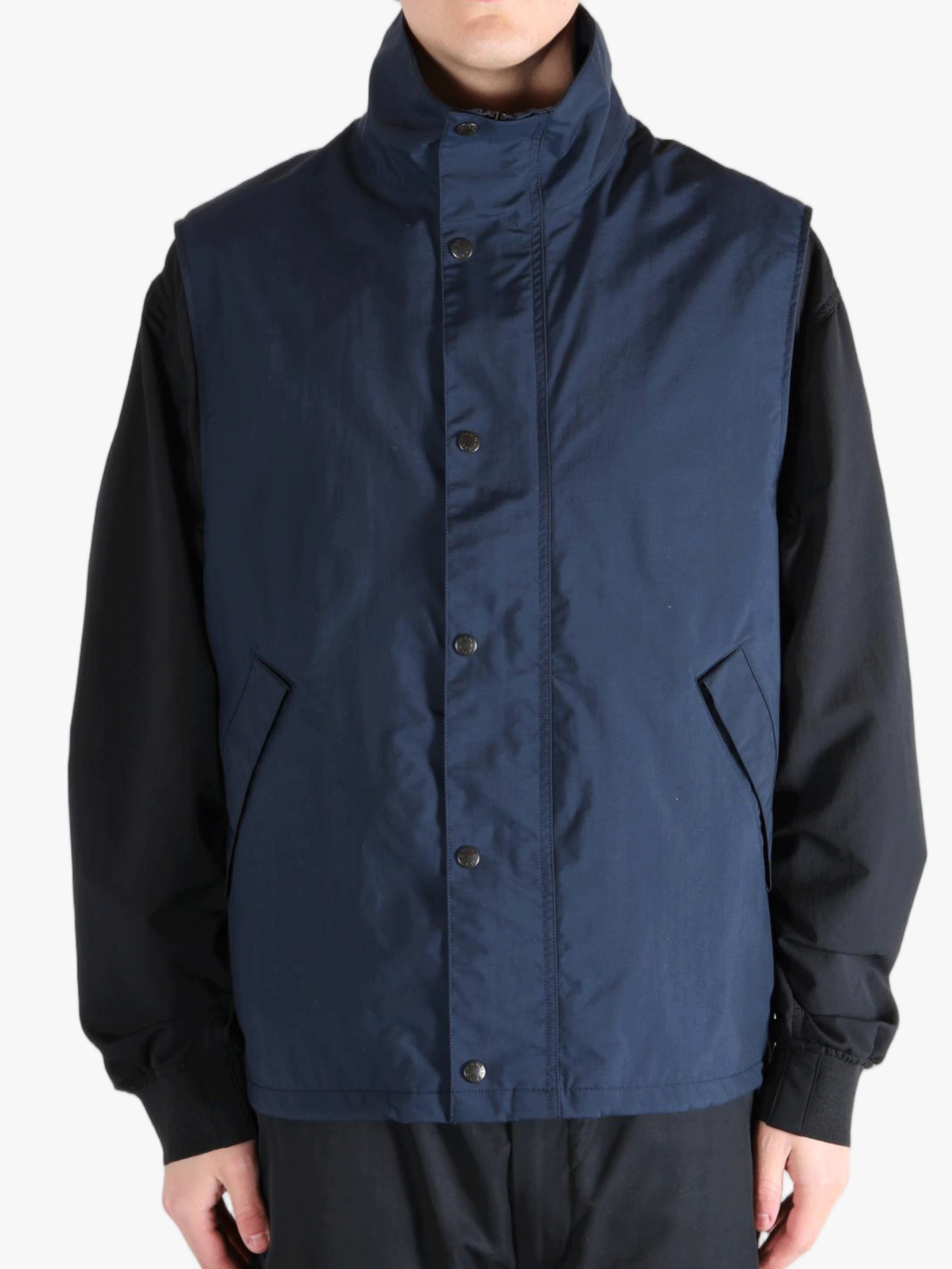 Blue tops worn by a person, showing the tops fit