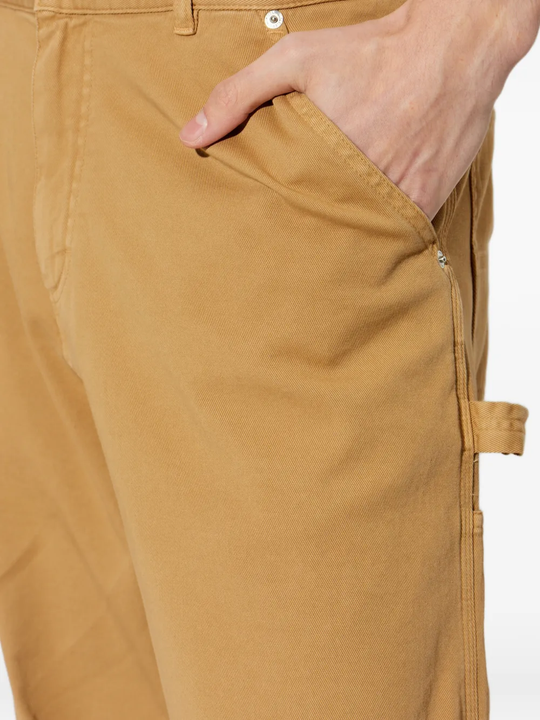 Close up of brown pants, showing texture of the Cotton fabric