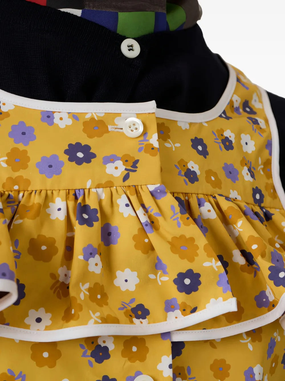 Cloes up of yellow top, showing texture of the cotton fabric