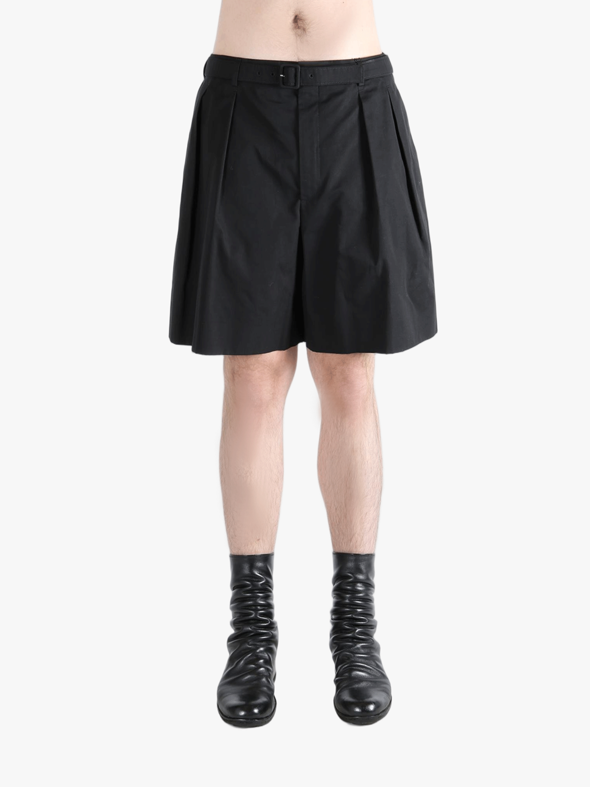 Black short worn by a person, showing the short's fit