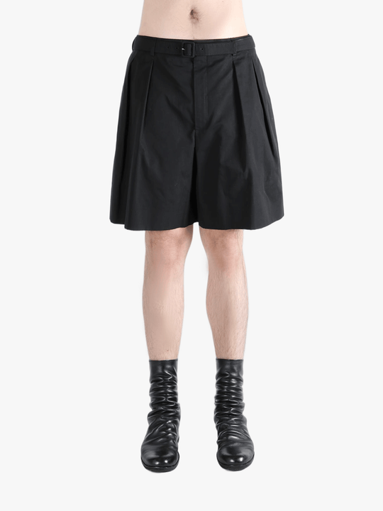 Black short worn by a person, showing the short's fit