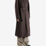 Brown coat worn by a person, showing the coat's fit