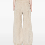 Tan pants worn by a person, showing the pants fit