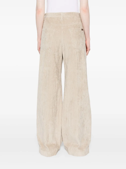 Tan pants worn by a person, showing the pants fit