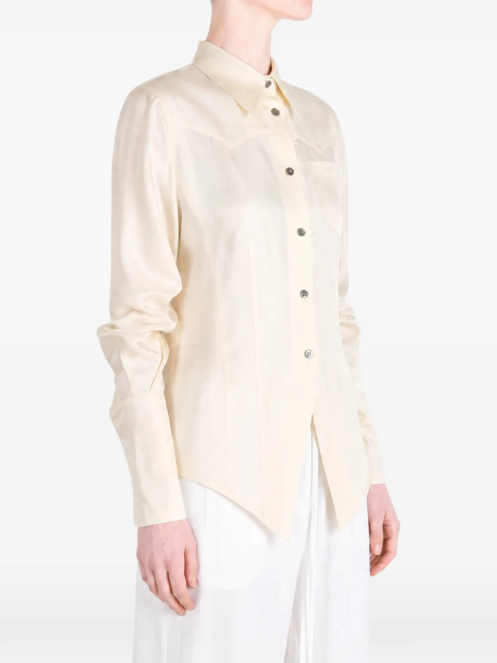 Tan shirt worn by a person, showing the shirt fit
