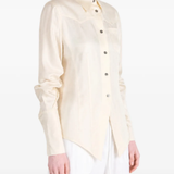 Tan shirt worn by a person, showing the shirt fit
