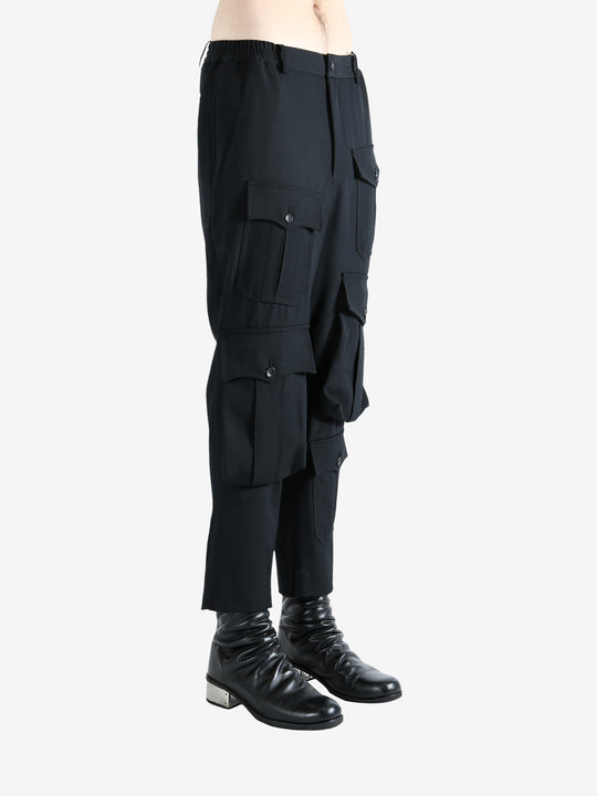 Black pants worn by a person, showing the pants fit