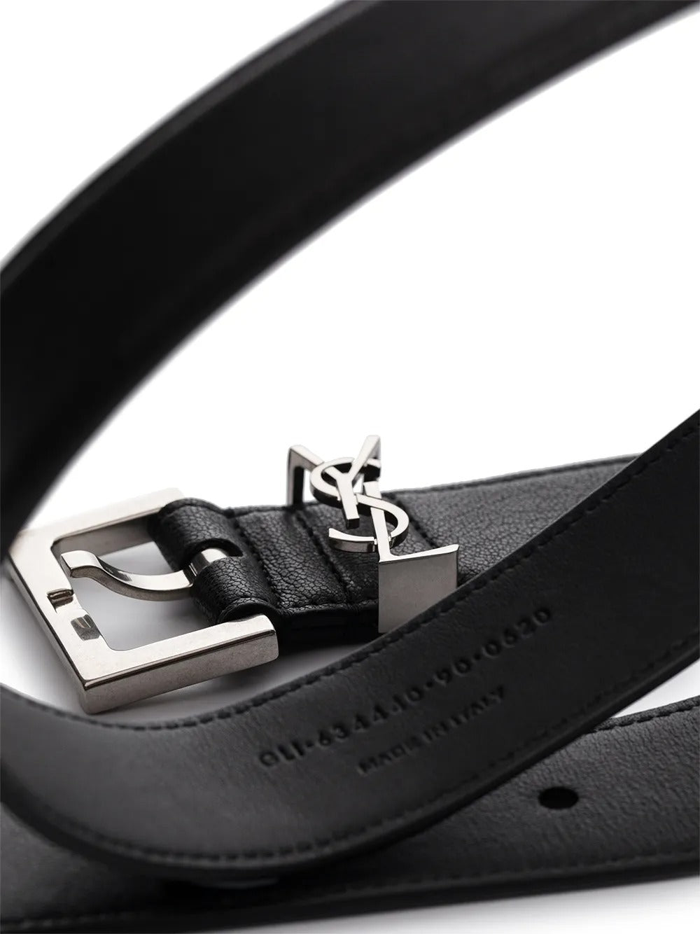 Close up of the black belt, showing texture of the leather fabric