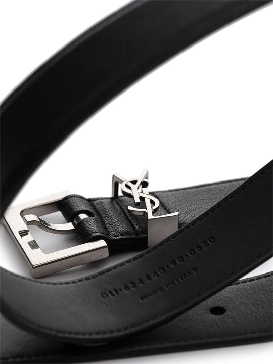 Close up of the black belt, showing texture of the leather fabric