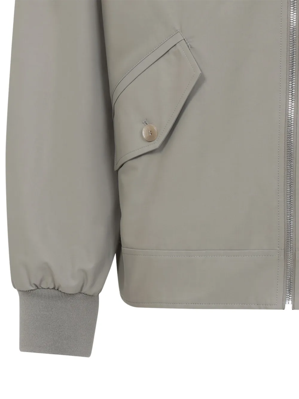 Close up of the tan jacket, showing texture of the wool fabric