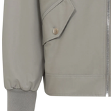 Close up of the tan jacket, showing texture of the wool fabric