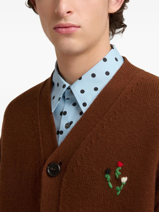 Brown knitwear worn by a person, showing the knitwear fit