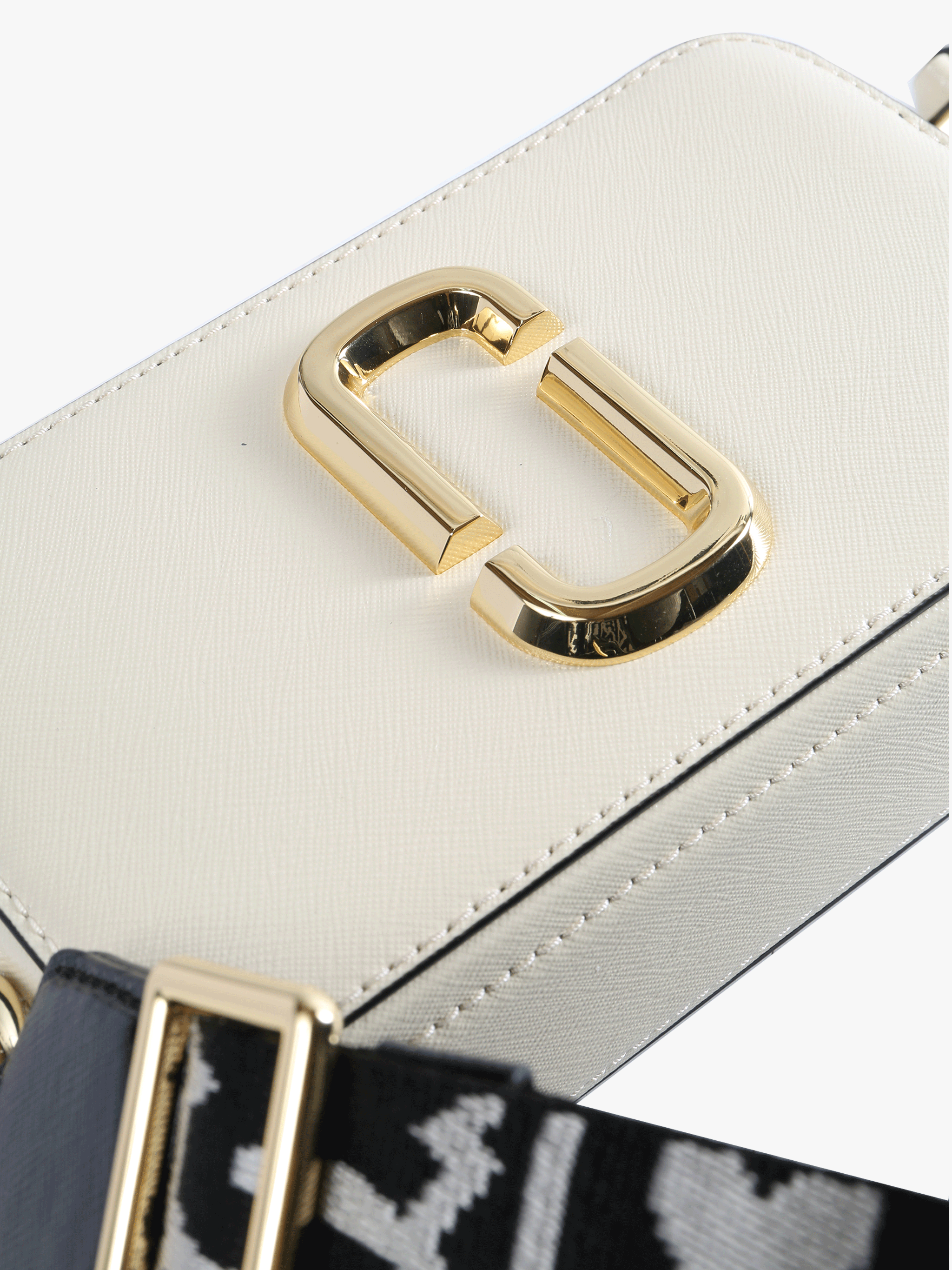 Close up of the white bag, showing texture of the leather fabric