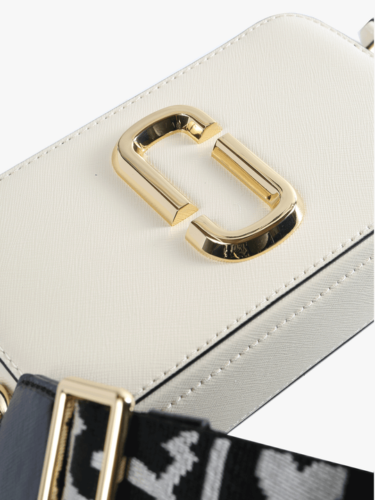 Close up of the white bag, showing texture of the leather fabric