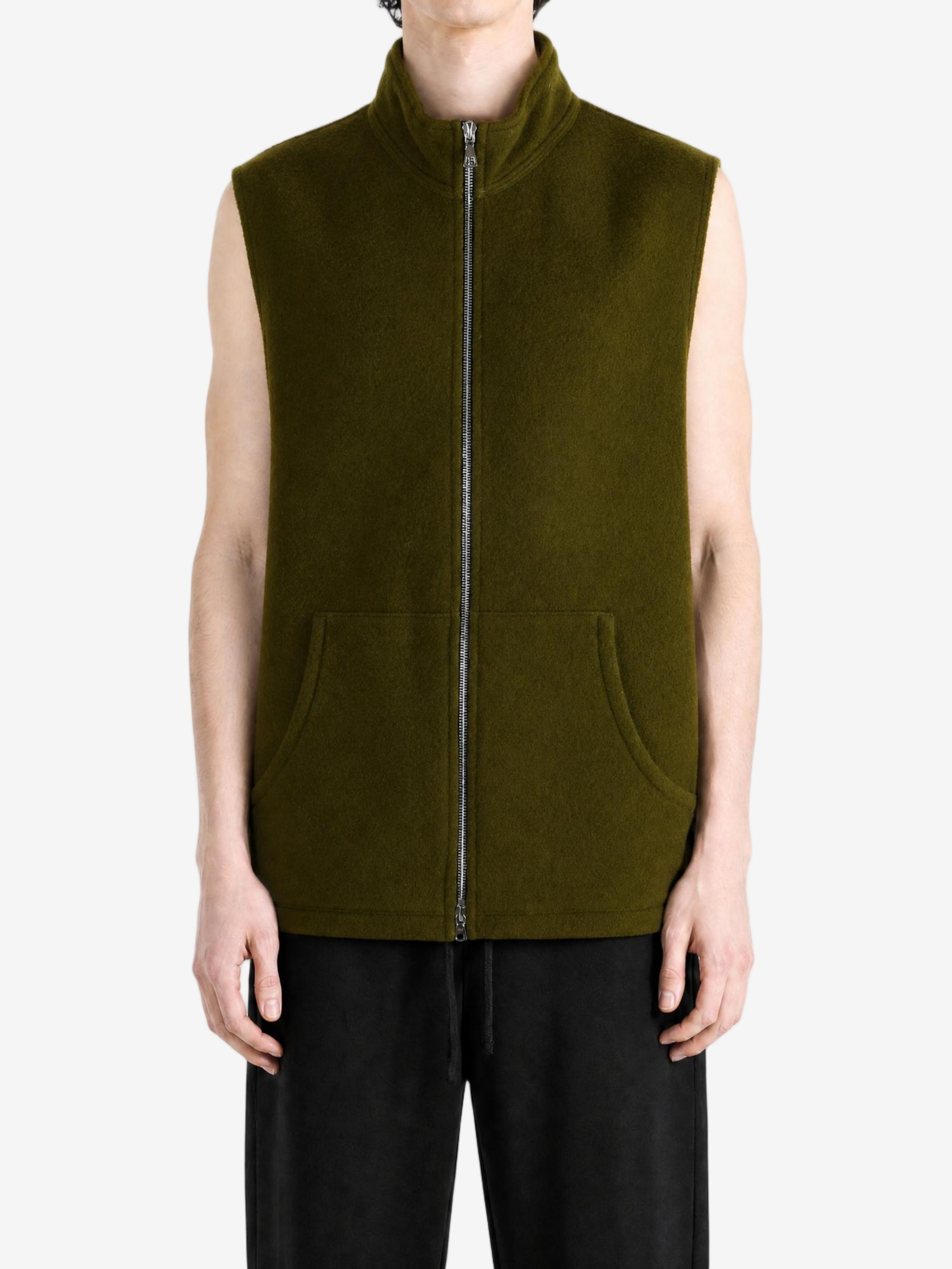 Green top worn by a person, showing the top fit