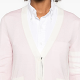 Close up of the pink knitwear, showing texture of the wool fabric