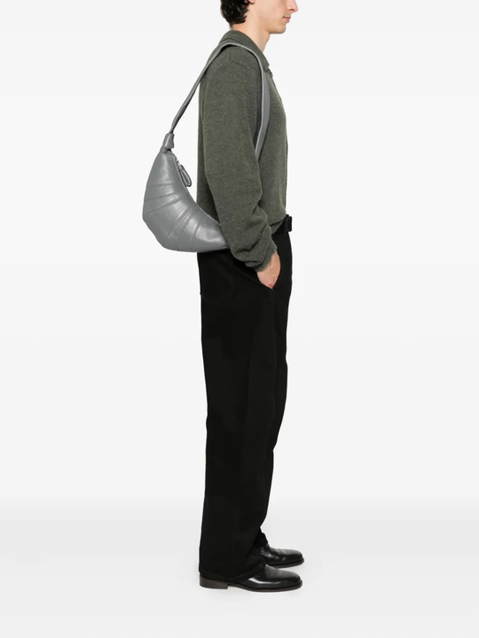 Grey bag worn by a person, showing the bag's fit