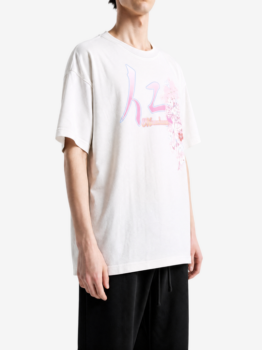 White t-shirt worn by a person, showing the t-shirt fit