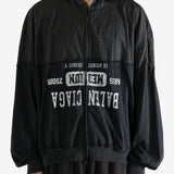 Black sweater worn by a person, showing the sweater's fit