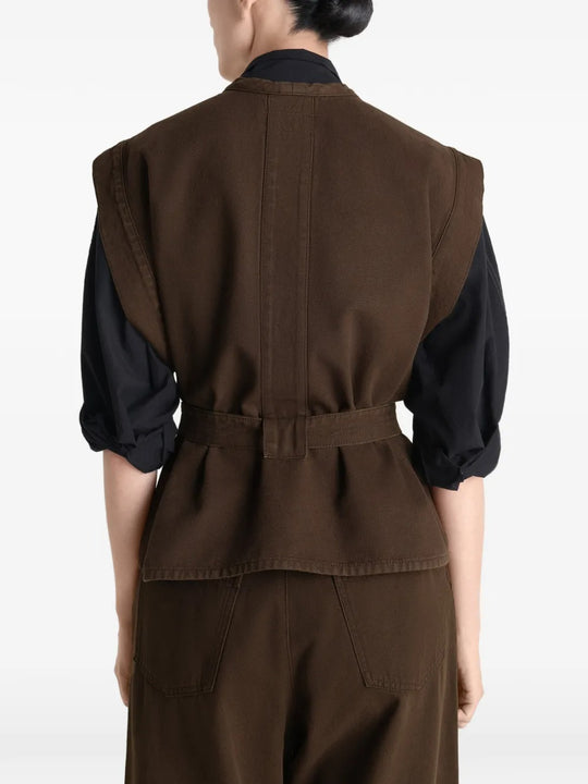 Brown top worn by a person, showing the top's fit