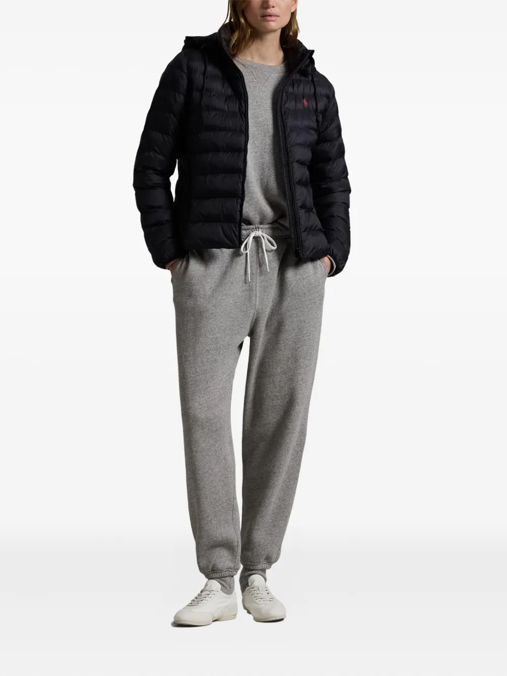 Black jacket worn by a person, showing the jacket's fit