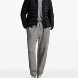 Black jacket worn by a person, showing the jacket's fit