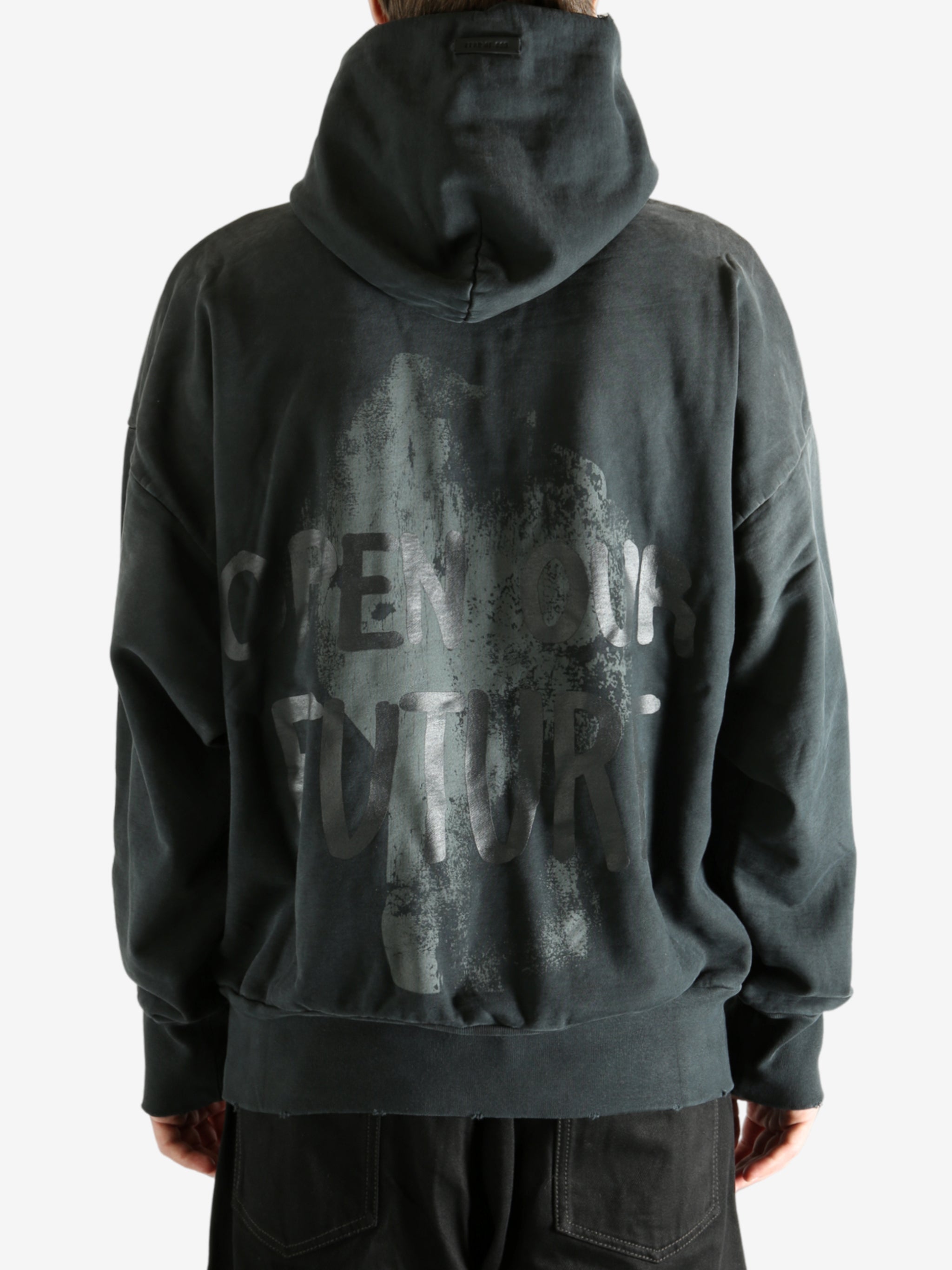 Black hoodie worn by a person, showing the hoodie's fit