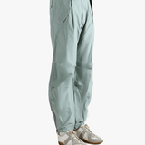 Blue pants worn by a person, showing the pants's fit
