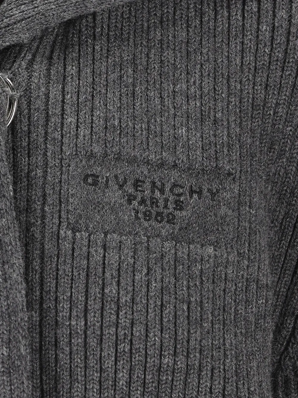 Close up of grey tops, showing texture of the wool and alpaca wool fabric