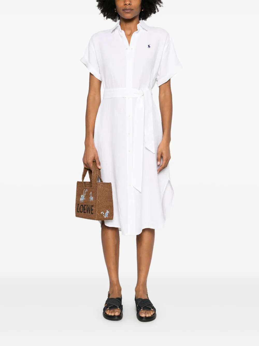 White dress worn by a person, showing the dress's fit