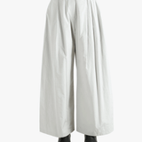 Grey pants worn by a person, showing the pants' fit