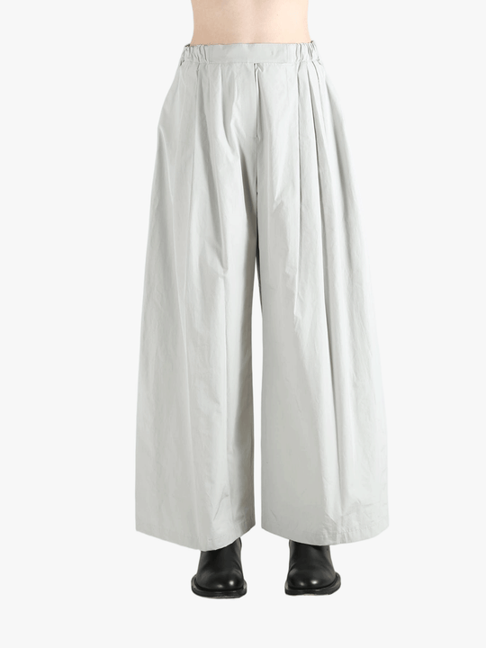 Grey pants worn by a person, showing the pants' fit