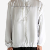 White jacket worn by a person, showing the jacket's fit