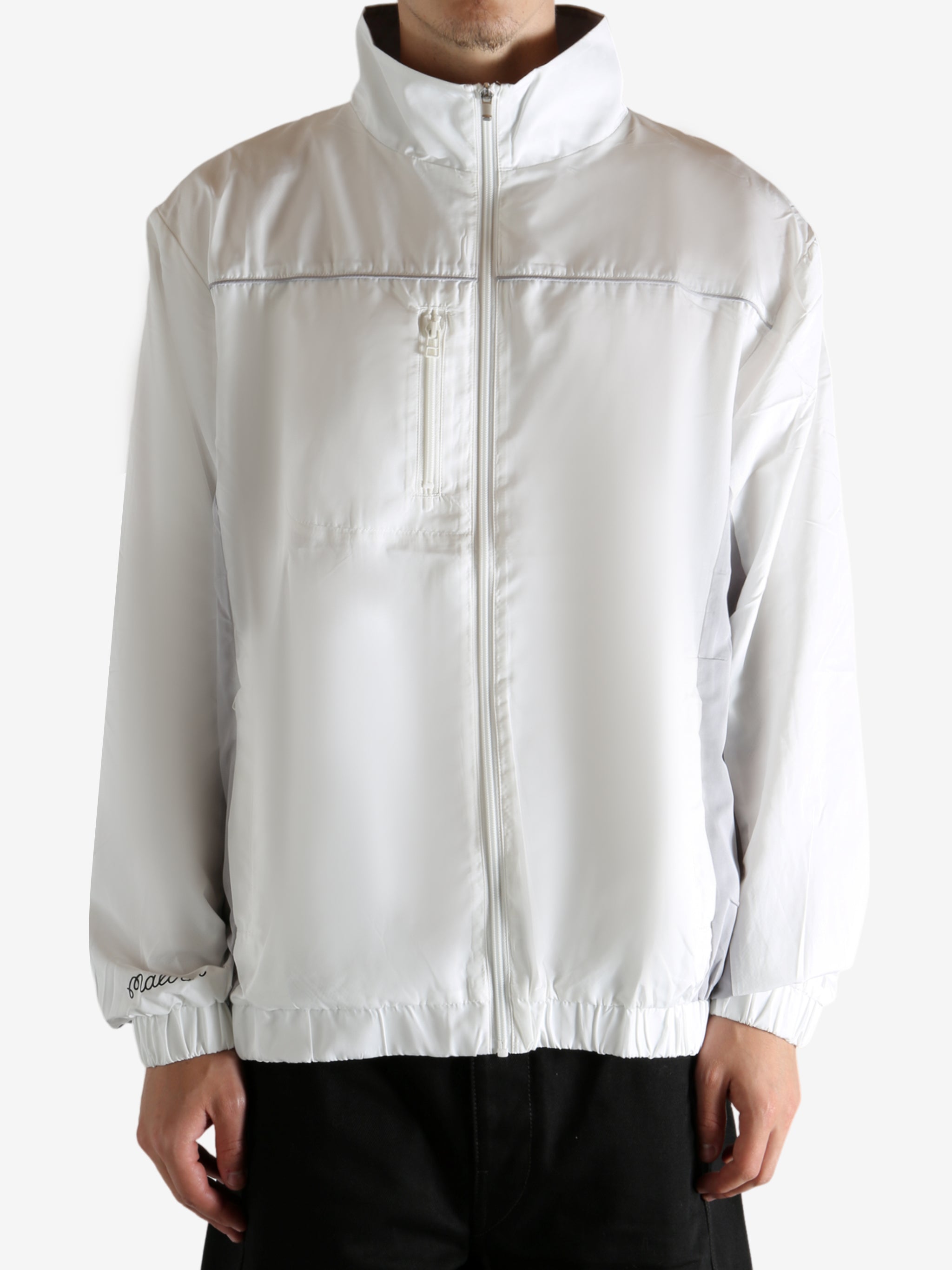 White jacket worn by a person, showing the jacket's fit