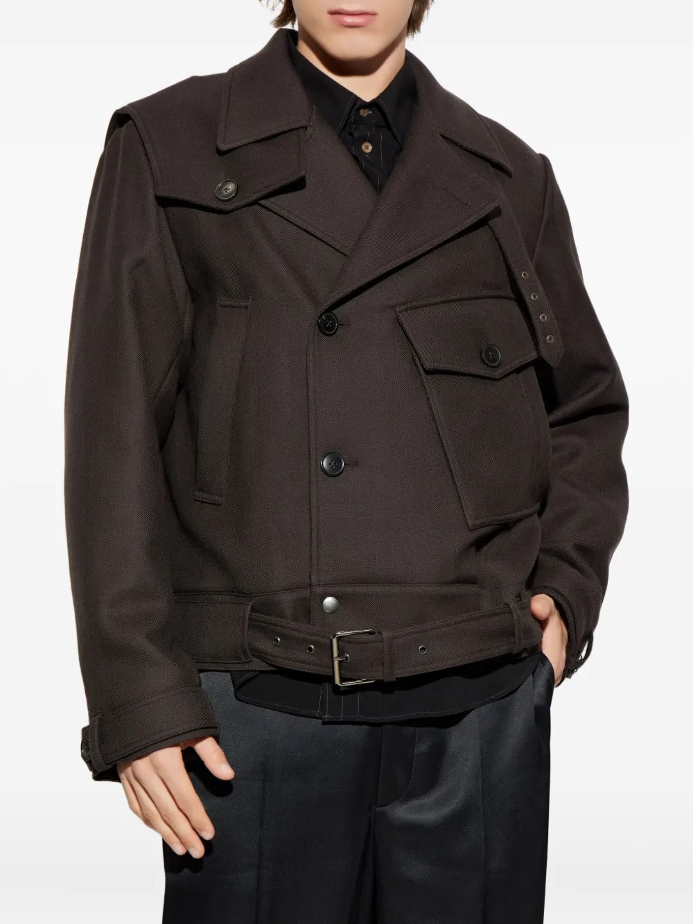 Brown jacket worn by a person, showing the jacket's fit