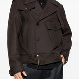 Brown jacket worn by a person, showing the jacket's fit